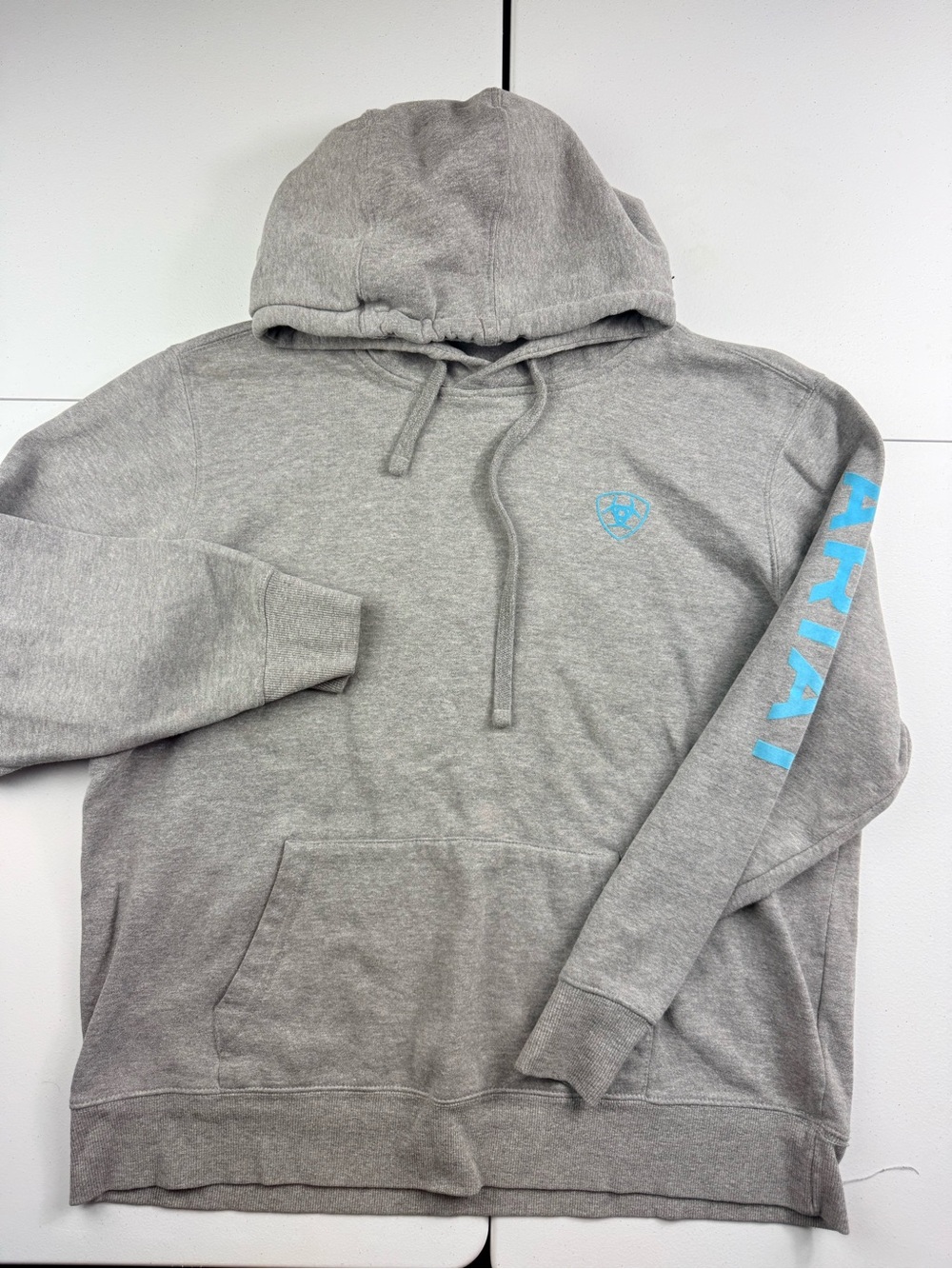 Ariat women’s Heather Gray Hoodie with Sky Blue Logo